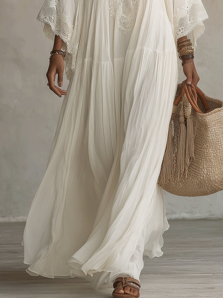 Celeste | Lange jurk van ivoorkleurig chiffon met vleermuismouwen en witte kantdetails