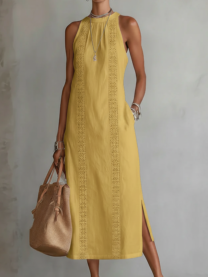 Alessandra | Mouwloos midi-jurk in het wit met geborduurde details en zijzakken