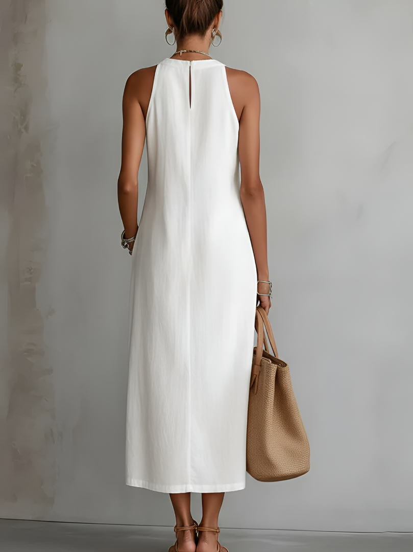 Alessandra | Mouwloos midi-jurk in het wit met geborduurde details en zijzakken